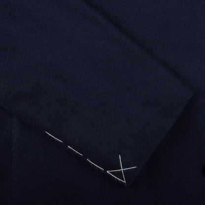 A close up of a navy blue Boglioli K.Jacket suit with silver stitching and unstructured craftsmanship.