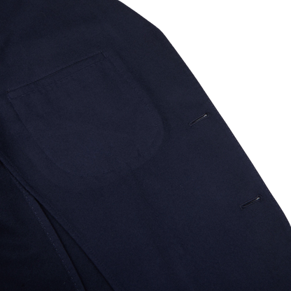 A close up of the pocket of a navy Boglioli K.Jacket with unstructured craftsmanship.