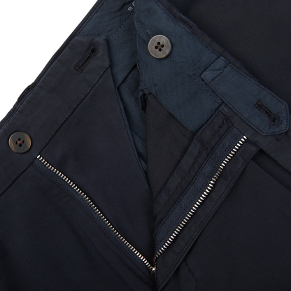 Close-up of a Boglioli navy blue jacket with zipped pocket and button details.