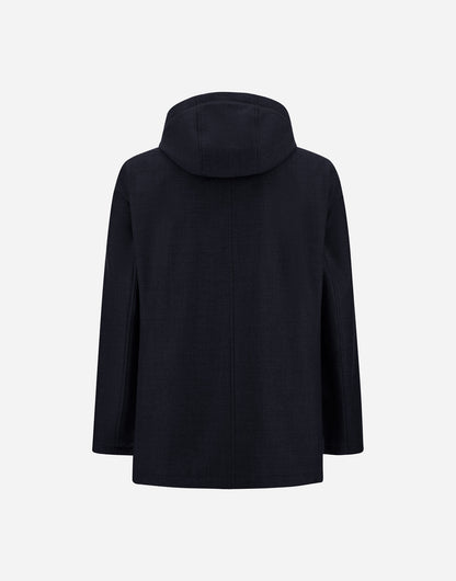 A navy blue, long-sleeved parka with a removable hood from Herno is displayed against a plain white background. The image shows the back of the coat, highlighting its straight silhouette and minimalistic design. Expertly crafted from luxurious Loro Piana wool and silk, this parka features no visible closures, pockets, or embellishments for an elegantly refined look. , available at Richard Gelding Mayfair