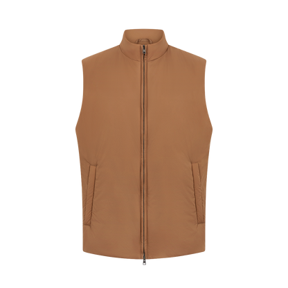 The Herno Camel Brown Lightweight Nylon Gilet is a sleeveless outerwear with a stand collar and two slanted side pockets, featuring a minimalist design in smooth nylon, displayed against a plain white background. , available at Richard Gelding Mayfair