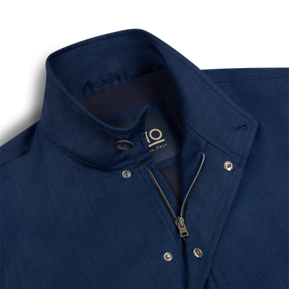 A close-up of a Herno Navy Wool/Silk/Linen Loro Piana Storm System Car Coat with a standing collar, silver snap buttons, and partially open zipper. The inner label shows size 10 and Made in Italy. The fabric is smooth with subtle sheen and slight texture. , available at Richard Gelding Mayfair