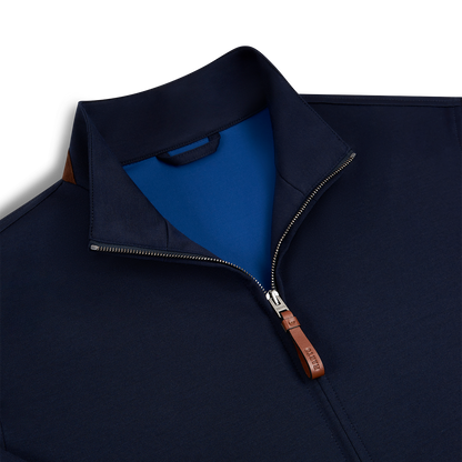 A close-up of the Manto Navy Loro Piana Wool/Silk Rain System Asiago Blouson, featuring a blue inner collar, silver zipper with brown leather pull, and a brown accent on the back collar, shown against a white background. , available at Richard Gelding Mayfair