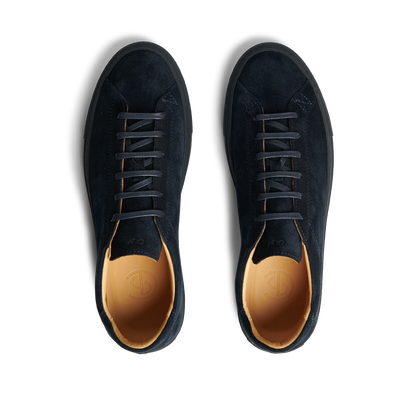 A pair of All Blue Suede Leather Racquet Sr Sneakers by CQP, with brown inner lining, white laces, and added arch support, viewed from above.