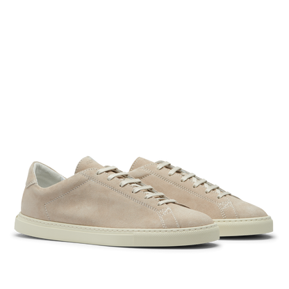 A pair of Beige Suede Leather Racquet Sneakers with white laces and a Margom rubber sole, displayed against a transparent background by CQP.