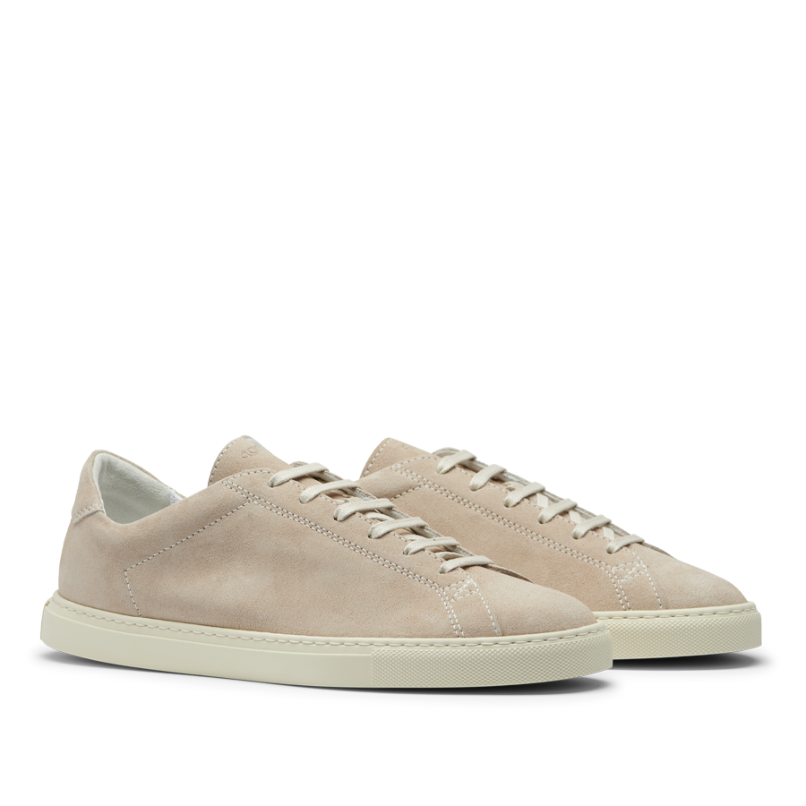 A pair of Beige Suede Leather Racquet Sneakers with white laces and a Margom rubber sole, displayed against a transparent background by CQP.