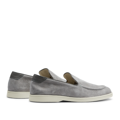 A pair of comfortable Cement Grey Suede Leather Debonair Loafers slip-on shoes with white soles by CQP on a transparent background.