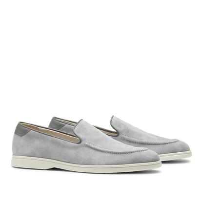 A pair of men's comfortable CQP Cement Grey Suede Leather Debonair Loafers with white soles.