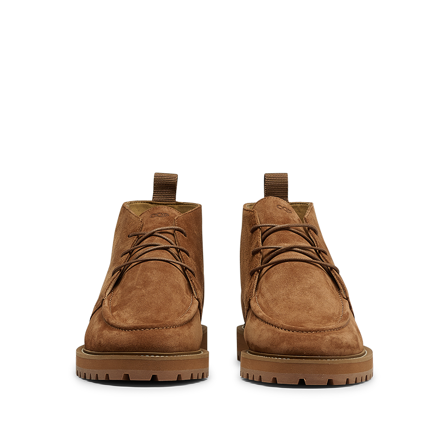 The Snuff Suede Leather Astra Dessert Boots by CQP showcase a luxurious brown suede upper, complemented by robust lace-up detailing and thick soles, beautifully captured from the front.