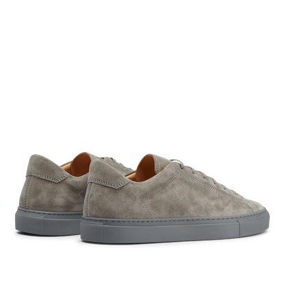A pair of Granit Grey Suede Leather Racquet Sr sneakers by CQP with thick rubber soles, displayed on a transparent background.