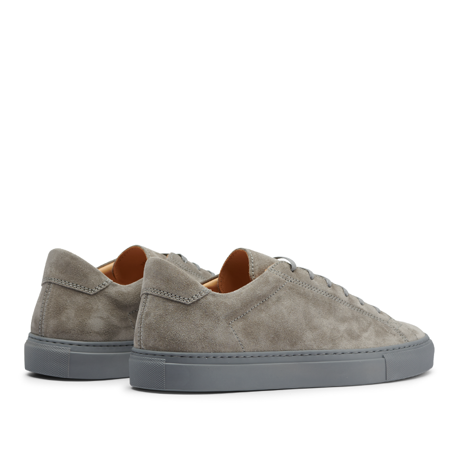 A pair of Granit Grey Suede Leather Racquet Sr sneakers by CQP with thick rubber soles, displayed on a transparent background.