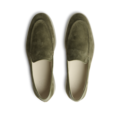 A pair of CQP Juniper Green Suede Leather Debonair Slippers with a rubber sole designed by a Swedish designer.