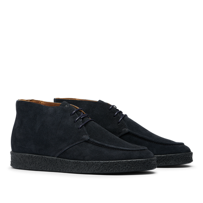 The CQP Navy Blue Suede Leather Plana Boots feature a stylish ankle-high design, complete with crepe soles and laces.
