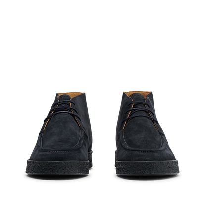 Front view of the CQP Navy Blue Suede Leather Plana Boots featuring black laces and crepe rubber soles.