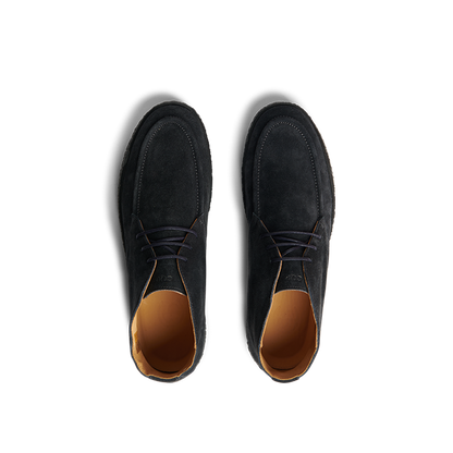 Top-down view of a pair of navy blue suede leather Plana boots by CQP, featuring tan interior linings and crepe soles.