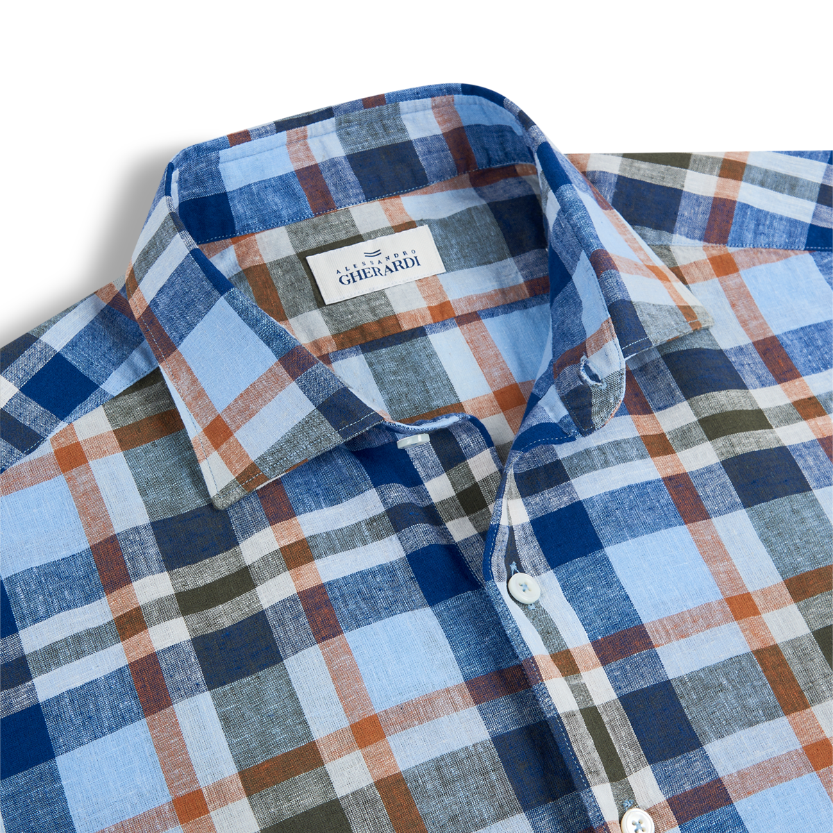 A close-up of the Alessandro Gherardi Blue/Orange Checked Linen Spread Collar Casual Shirt, neatly folded with a spread collar and white buttons. The background is white, and the label is visible inside the collar. , available at Richard Gelding Mayfair