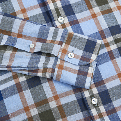 A close-up of the Alessandro Gherardi Blue/Orange Checked Linen Spread Collar Casual Shirt, neatly laid flat with sleeves folded over the chest, displaying white buttons on the cuff and placket. , available at Richard Gelding Mayfair