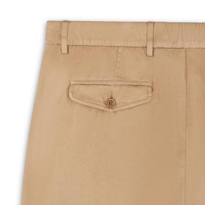 Close-up of Barmas Beige Cotton/Silk Stretch Waistband Chinos, showing the back flap pocket with button closure, belt loops, smooth lightweight fabric, and detailed tailoring with precise stitching. , available at Richard Gelding Mayfair