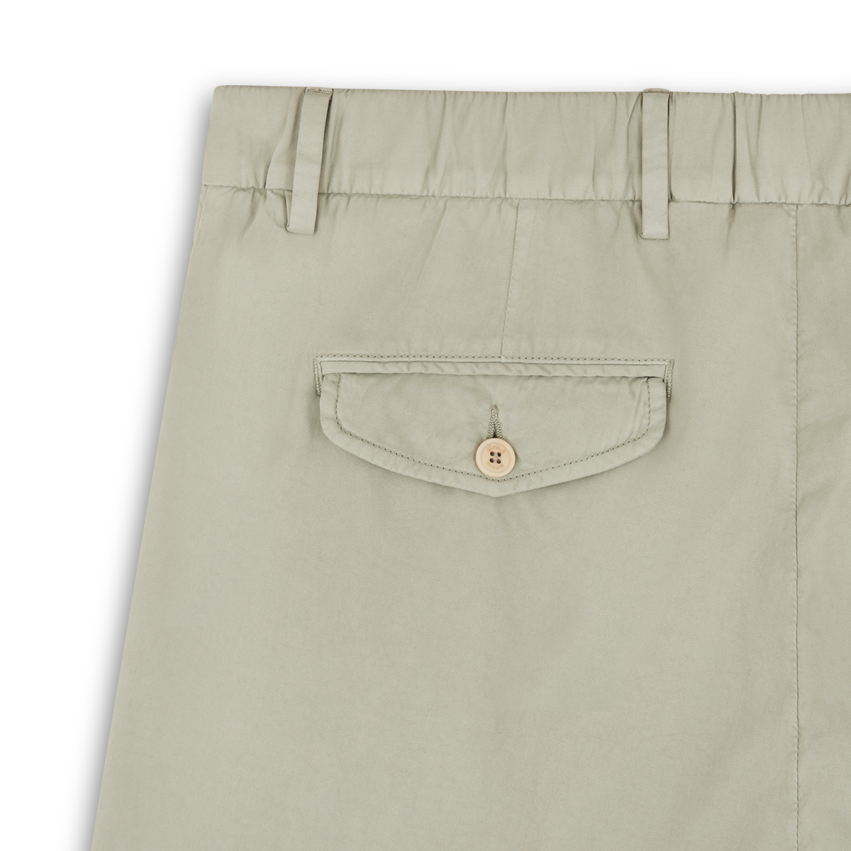 Close-up of Barmas Sage Green Cotton/Silk Chinos, highlighting the upper back with elastic waistband, belt loops, and a single buttoned-flap back pocket. The tan button complements the smooth, lightweight fabric. , available at Richard Gelding Mayfair
