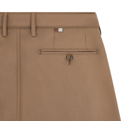 Close-up of Canali Brown Cotton Poplin Self-Belt Trouser showing a belt loop, welt pocket with brown button, visible stitching, and a red, white, and gray logo tab above the pocket. The smooth fabric has a subtle texture. , available at Richard Gelding Mayfair