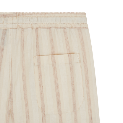 Close-up of Fedeli Cream Striped Linen Drawstring Trousers, featuring vertical taupe and cream stripes, an elastic waistband with drawstring, visible patch pocket, and lightweight linen fabric—perfect for casual or lounge wear. , available at Richard Gelding Mayfair