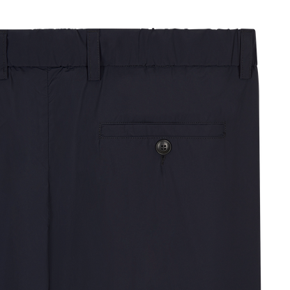 Close-up of Fedeli’s Navy Blue Bi-Stretch Technical Trousers, showing a single welt pocket with black button, belt loops on the waistband, and smooth matte-finish fabric—ideal for comfortable office wear. , available at Richard Gelding Mayfair