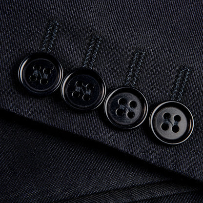 Close up of Canali Navy Blue Wool Notch Lapel Suit with structured shoulders.