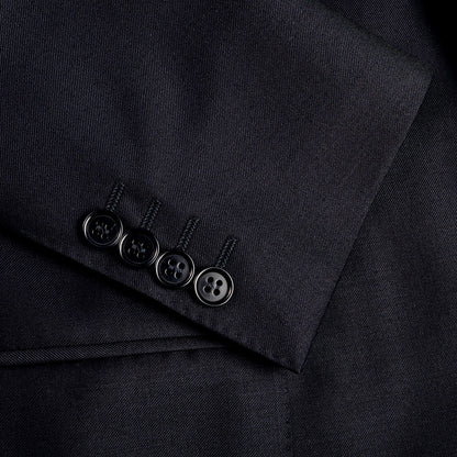 A close up of a button on a Canali Navy Blue Wool Notch Lapel Suit.