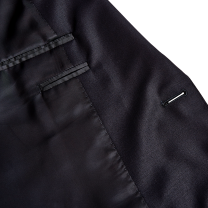 A timeless Navy Blue Wool Notch Lapel Suit with buttons exuding classic sartorial elegance by Canali.