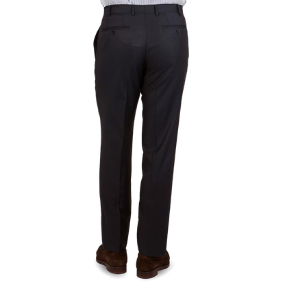 The back view of a man wearing a Canali Navy Blue Wool Notch Lapel Suit with structured shoulder and classic sartorial elegance.