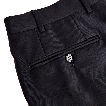 A pair of Canali Navy Blue Wool Notch Lapel Suits with a button on the side, perfect for formal attire.