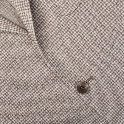 Close-up of a button on a Canali Beige Houndstooth Cotton Jersey Blazer.