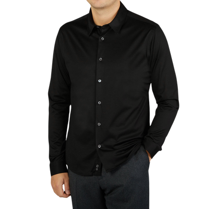 A contemporary man wearing a Canali Black Cotton Jersey Casual Shirt.