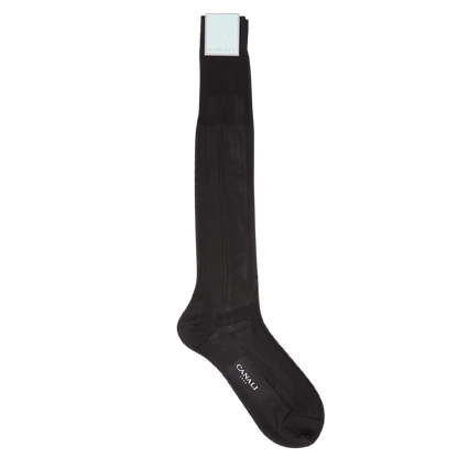 A pair of black knee length silk dress socks on a white background by Canali.
