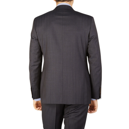 A man wearing a Canali Blue Brown Melange Striped Wool Suit from the back.