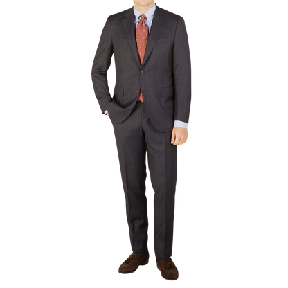 A man is posing for a picture in a Canali Blue Brown Melange Striped Wool Suit.