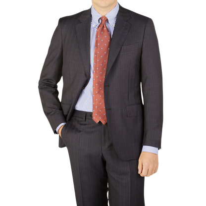 A man is posing in a blue-brown striped Blue Brown Melange Striped Wool suit by Canali.