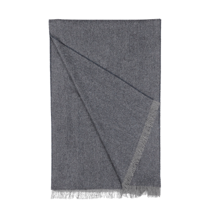 The Blue Grey Herringbone Cashmere Scarf by Canali exudes timeless elegance with its luxurious design, featuring a folded style and fringed edges crafted from the finest cashmere.