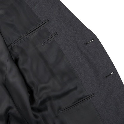 A close up of a Canali Charcoal Grey Wool Notch Lapel Suit with black buttons.