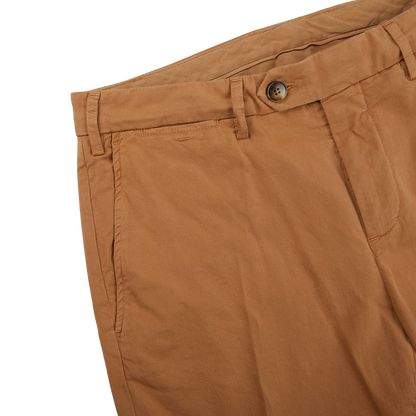 A close up of a pair of Canali Terracotta Cotton Stretch Flat Front Chinos with a distressed appearance.