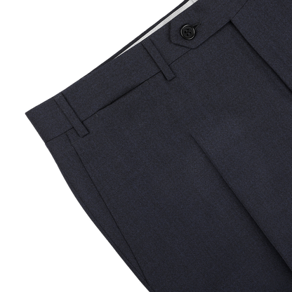 Detailed view of the Canali Dark Blue Melange Wool Flat Front Trousers, showcasing a black button and belt loops against a light gray background.