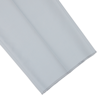 A neatly folded pair of Canali Dove Grey Flat Front Wool Twill Trousers, pale blue with a serged edge.