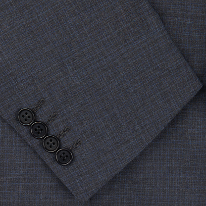 Close-up photo of a dark gray Canali Grey-Blue Melange Wool Suit fabric with a set of black buttons arranged in a line on it.