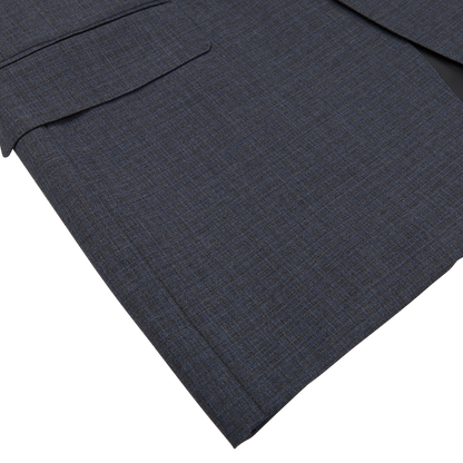 Close-up of a dark blue Canali Grey-Blue Melange Wool Suit fabric with visible weaves and tailored seams, displayed against a white background.