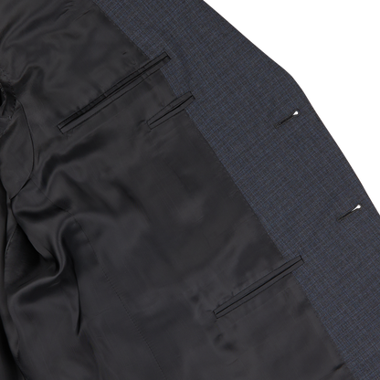 Close-up of a Canali Grey-Blue Melange Wool Suit jacket with black lining, showing detail of the fabric texture and inner pockets.
