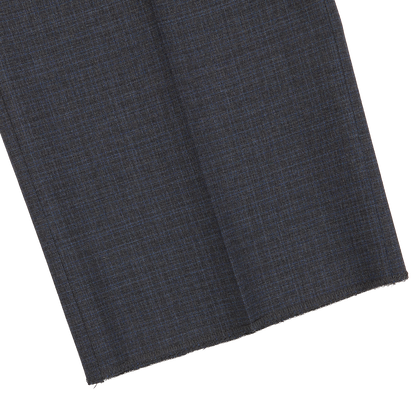 Folded grey-blue melange wool Canali suit fabric with a subtle texture, displayed on a white background.