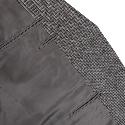 Close-up of the inside fabric of the Grey Dogtooth Wool Drop 6 Blazer by Canali, highlighting the Milanese style lining and three pockets.