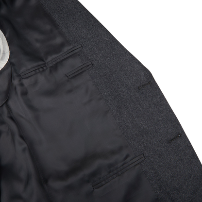 A close up of a Canali structured shoulder Grey Melange Wool Flannel Suit with a white pocket.