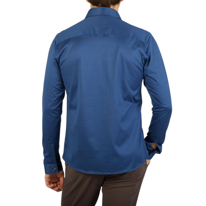 The back view of a contemporary man wearing an Indigo Blue Cotton Jersey Casual Canali shirt.