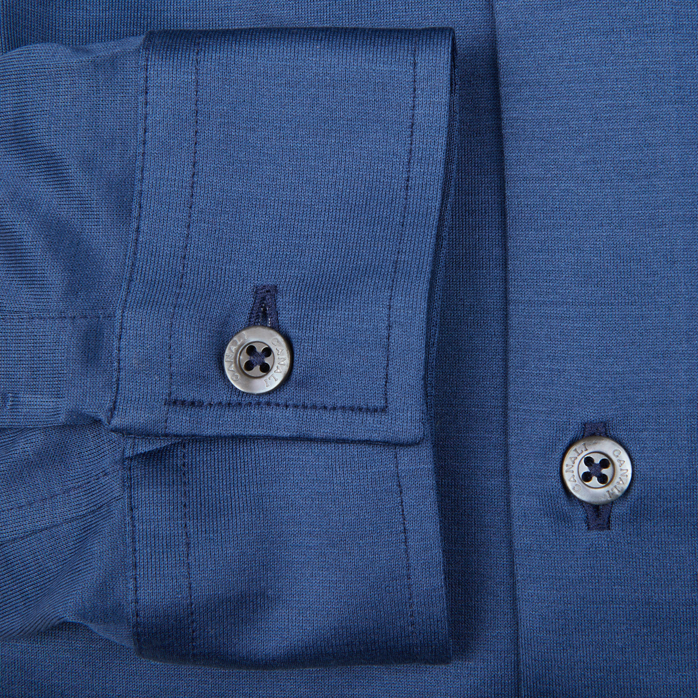 A close up of a contemporary man wearing a Canali Indigo Blue Cotton Jersey Casual Shirt with buttons.